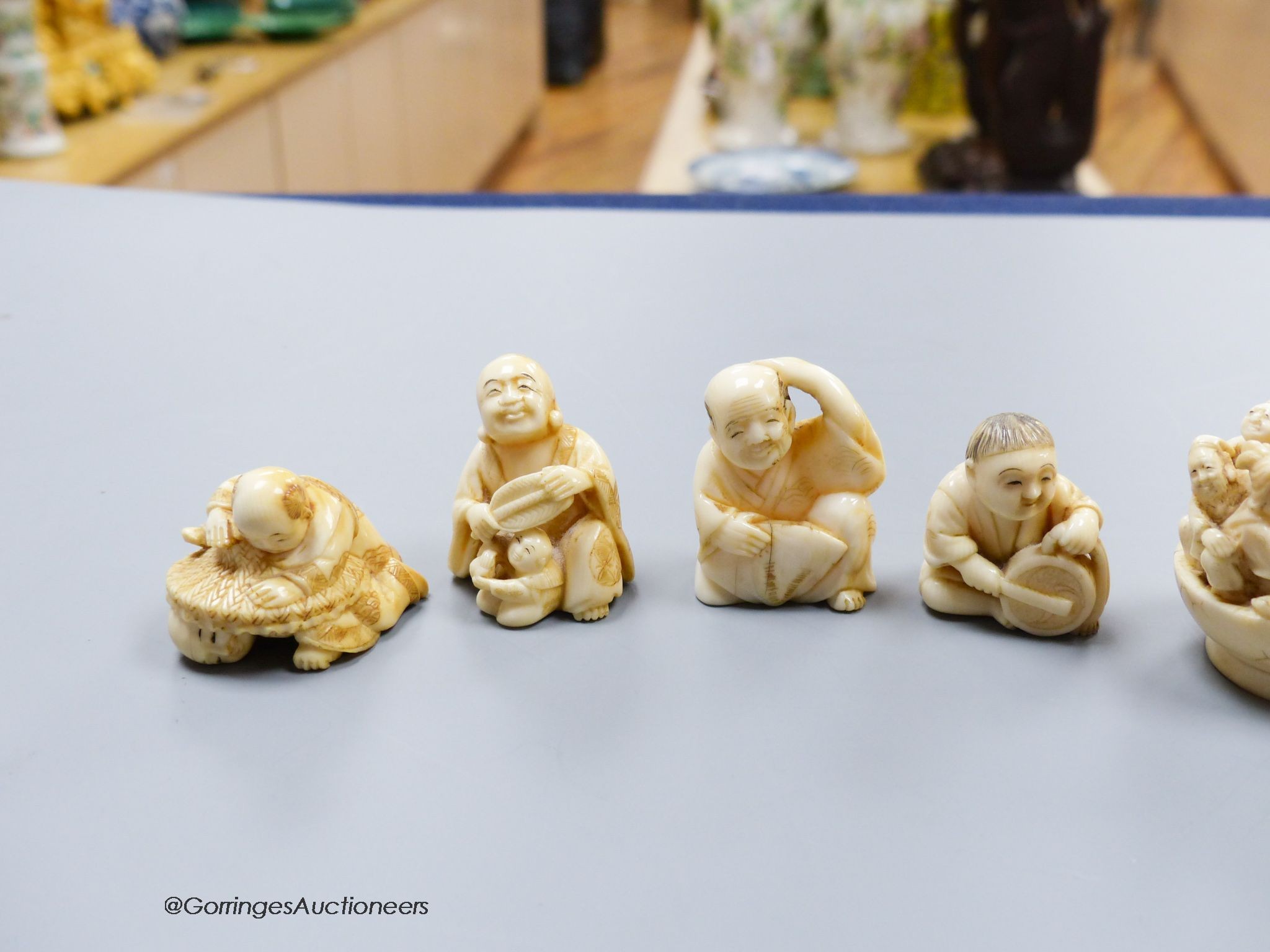 Five Japanese carved ivory netsukes, Meiji period, including an example of the seven gods of happiness, tallest 5cm